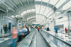 Travellers on moving walkways