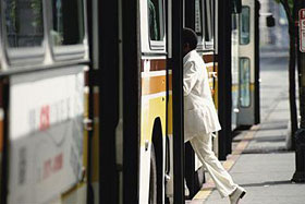 Person getting onto a bus